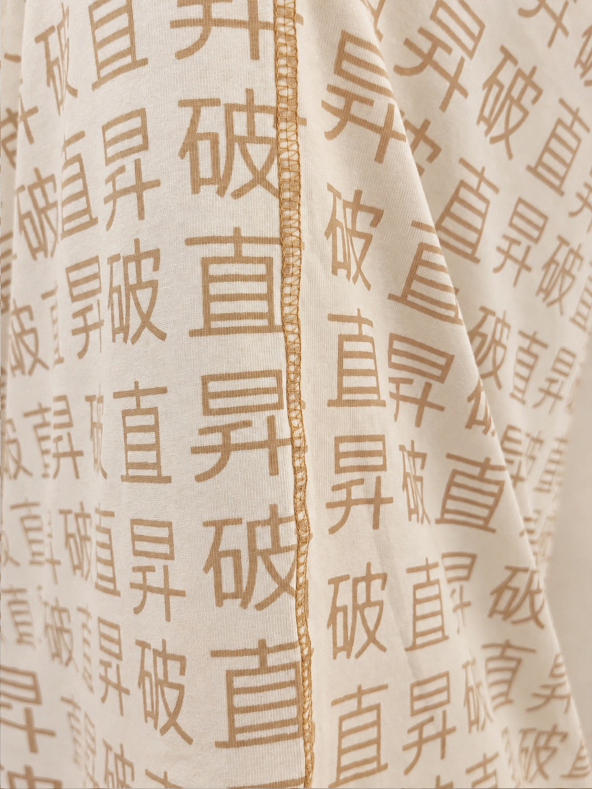 JSYM Tee stitching and print detail