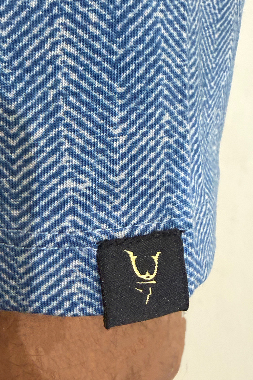 Herringbone Tee — sleeve label detail